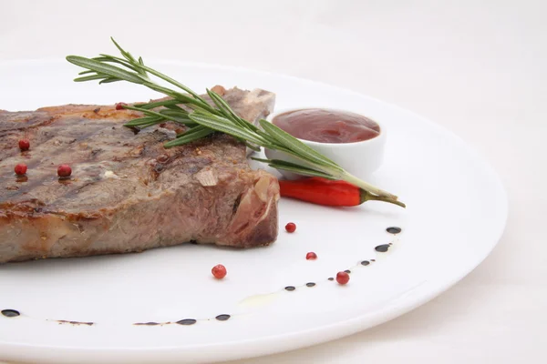 Stock image Rib-eye steak resting on a white plate