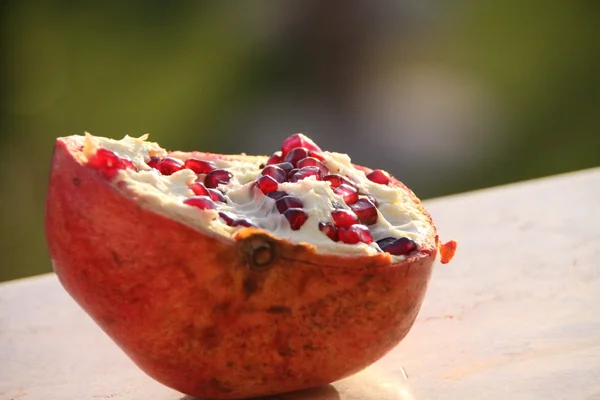 A piece of pomegranate with seeds Stock Photo