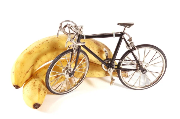 Speelgoed fiets en bananen — Stockfoto