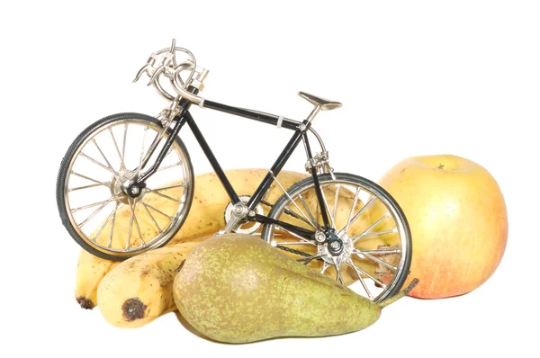 Spielzeug Fahrrad und Früchte — Stockfoto