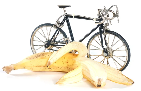 Oyuncak bisikleti ve muz — Stok fotoğraf