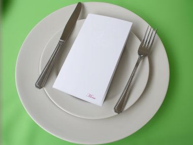 Menu over plate with copy space clipart