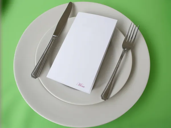 Menu over plate with copy space — Stock Photo, Image