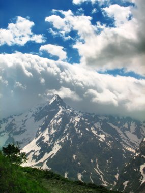 Amazing clouds above the mountains clipart