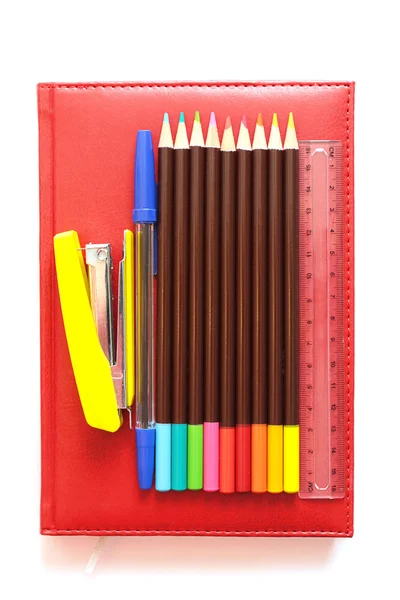 Various office supplies on the book — Stock Photo, Image