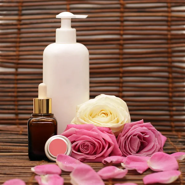 Cosmetics, roses and roses petals Stock Image