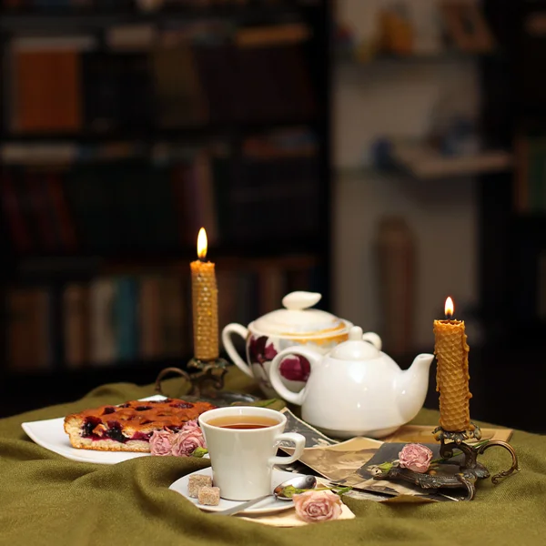 Tea against a background of candles — Zdjęcie stockowe