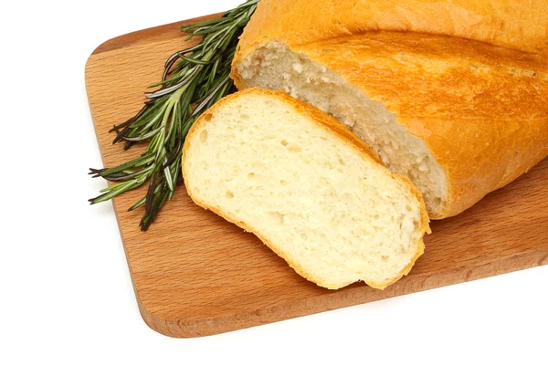 Tasty bread and herb on a wooden board — Stock Photo, Image