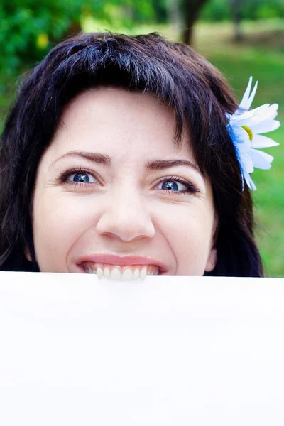 Portrait of a woman with white card — Stock Photo, Image