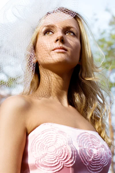 A young woman in a pink dresses — Stock Photo, Image