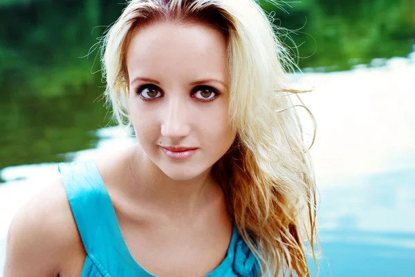 stock image The young woman near lake