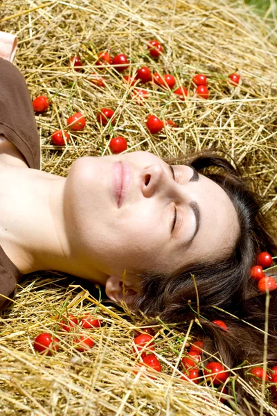 The young woman with cherry — Stock Photo, Image