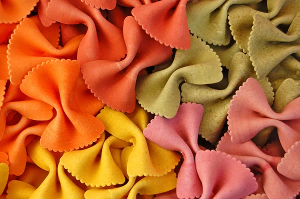 Farfalle colorate fondo pasta — Foto Stock