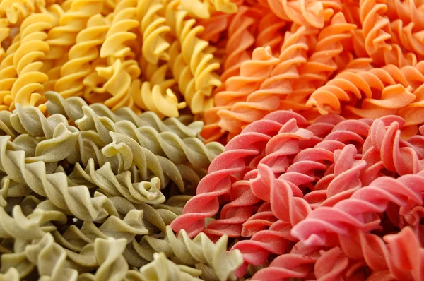 Four flavors of fusilli pasta — Stock Photo, Image
