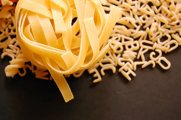 Tagliatelle and soup pasta — Stock Photo, Image