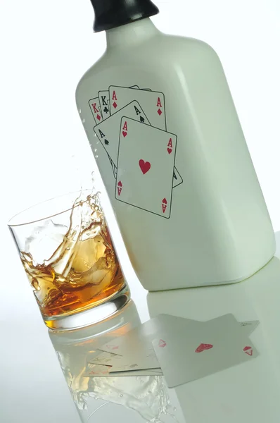 Poker and alcohol Royalty Free Stock Photos