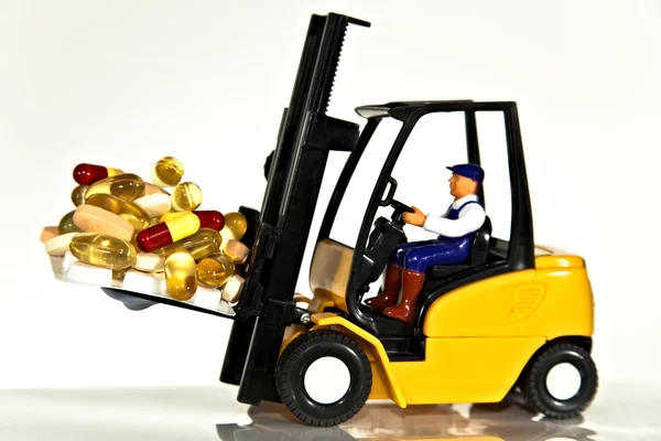 Fork lift and tablets — Stock Photo, Image