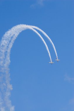 Two planes loop the loop clipart