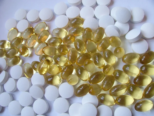 Yellow and white tablets — Stock Photo, Image