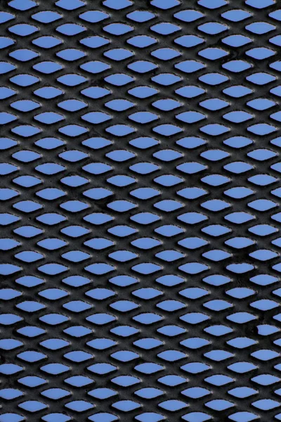 stock image Metal grid over blue background