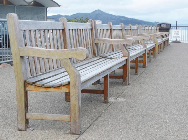 Row of wooden benches on the wharf — Stock Photo, Image