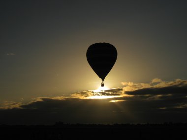 Hot air balloons in morning dusk clipart