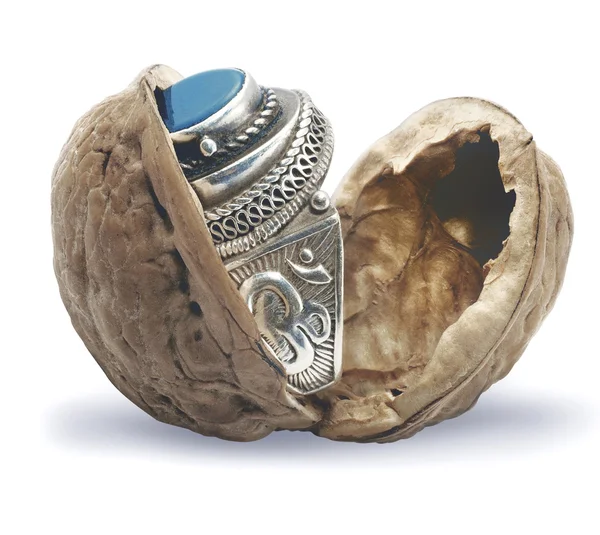 Ring with a light-blue stone in a shell — Stock Photo, Image