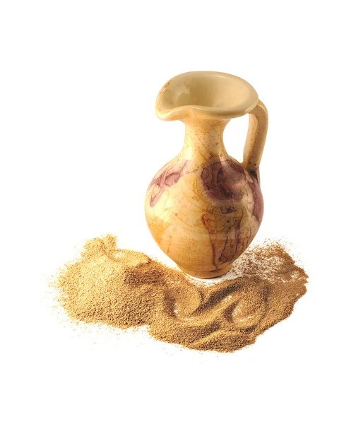 Sand of their desert and small jug. — Stock Photo, Image