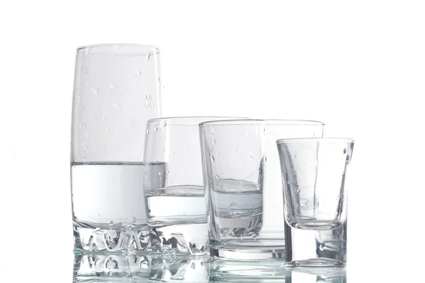 Four cups of liquid — Stock Photo, Image