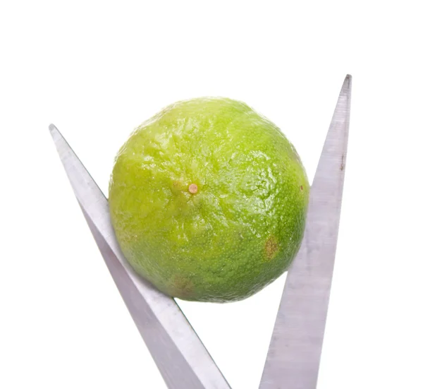 Lime and scissors — Stock Photo, Image