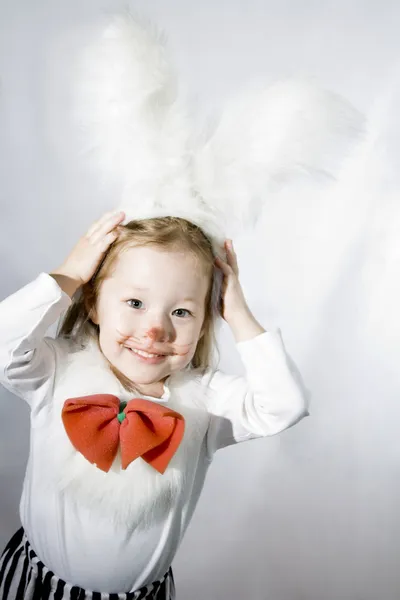 Girl in a white downy bunny costume. — Stock Photo, Image