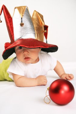 Small boy in the hat of jester clipart