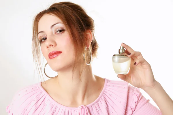 Pretty girl holding perfume — Stock Photo, Image