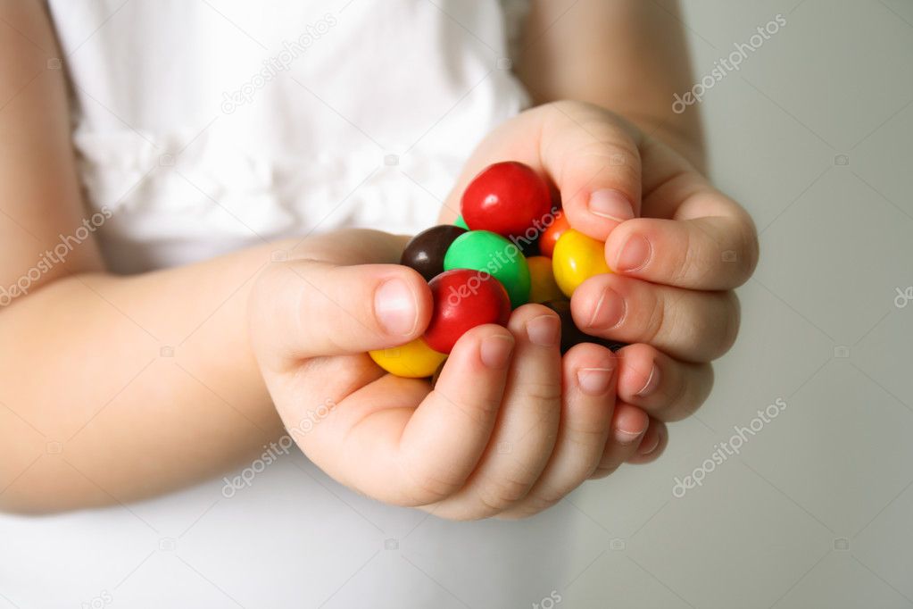 Child the hands the candies