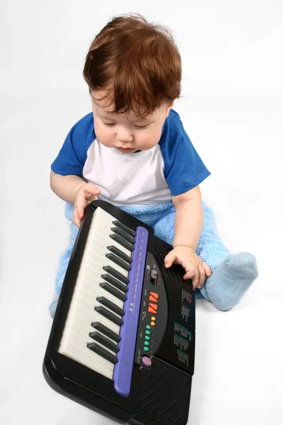 Little boy with electronic piano — Stock Photo, Image