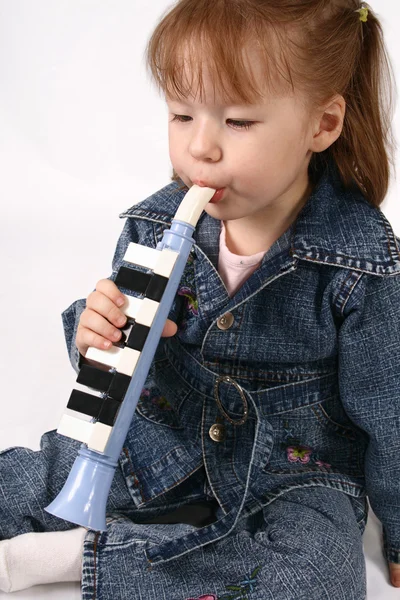 stock image Girl plays on the pipe