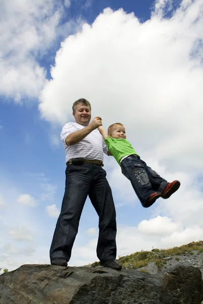 Father and his flying son — Stock Photo, Image