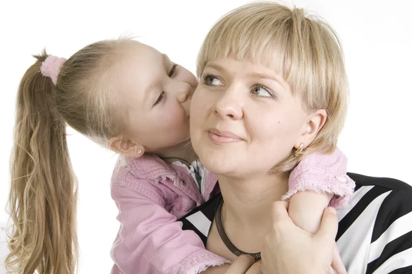 Daughter kissing her mother. — Stock Photo, Image
