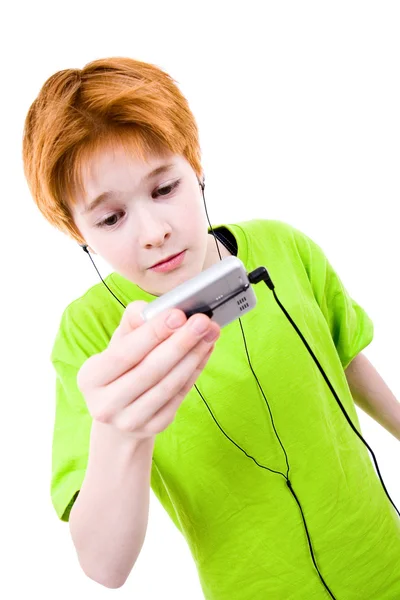 Red teen listens to music — Stock Photo, Image