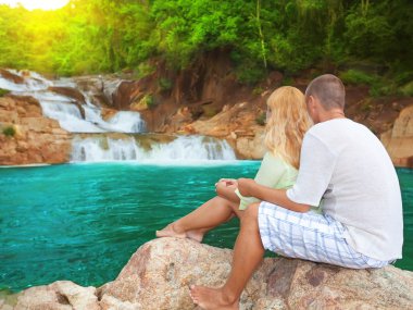 Couple near waterfall clipart