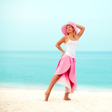 Fashion woman on the beach clipart