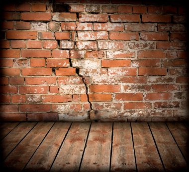 Brick wall with a large crack clipart