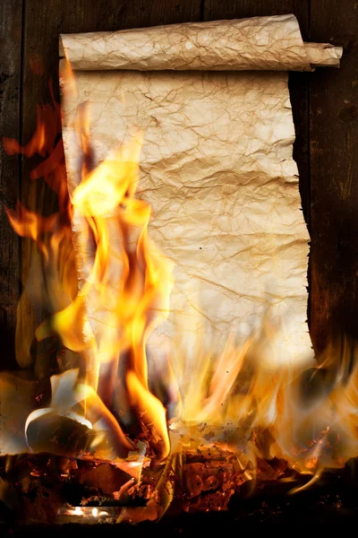 Ancient scroll on burns in the fire — Stock Photo, Image