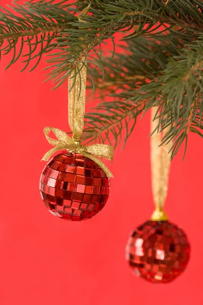 Christmas balls on red background — Stock Photo, Image