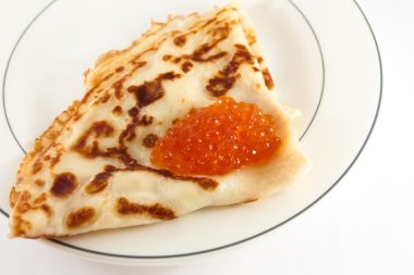 Russian pancake with red caviar clipart