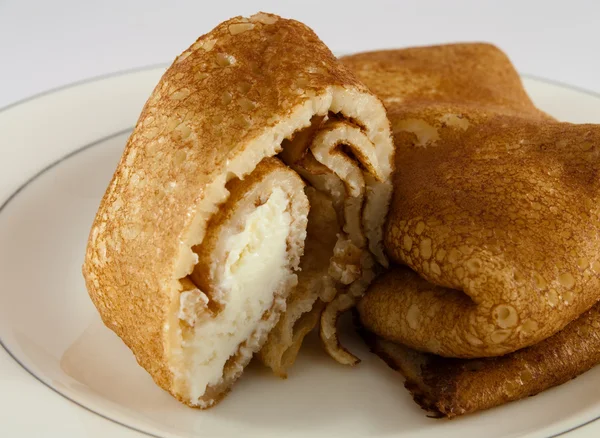 Pancakes with cream — Stock Photo, Image