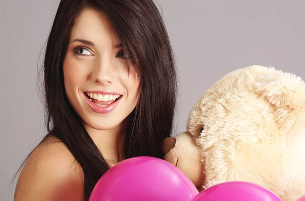 Hermosa chica con globos rosados — Foto de Stock