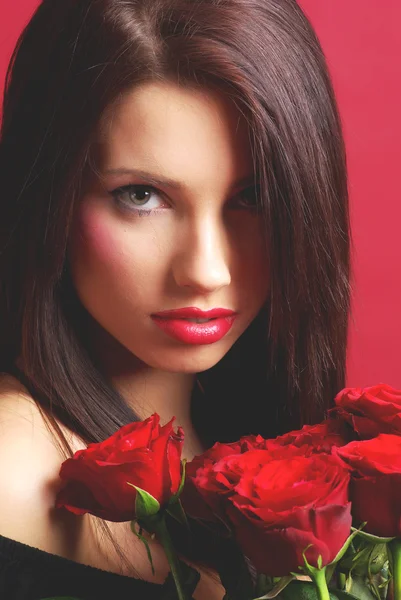Žena s růžemi — Stock fotografie