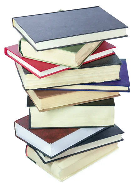 Куча книг, изолированных над белым — стоковое фото