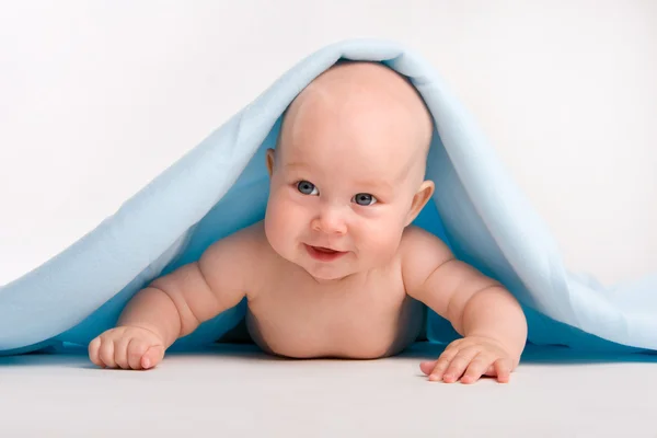 Beautiful baby under towel — Stock Photo, Image